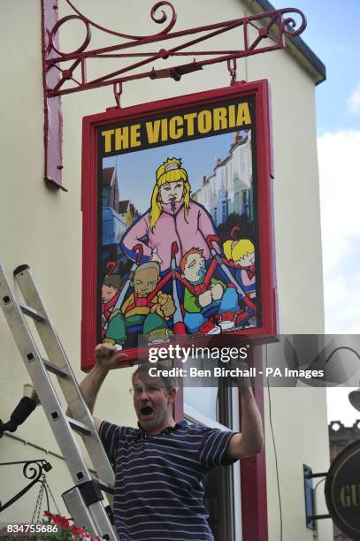 Pub owner Peter Gower-Crane stands outside his pub The Victoria in St Werburghs, Bristol, which has caused controversy by swapping a sign of Queen...