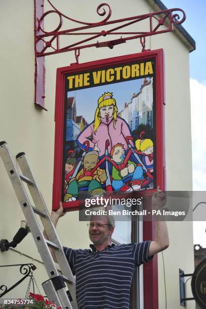 Pub owner Peter Gower-Crane stands outside his pub The Victoria in St Werburghs, Bristol, which has caused controversy by swapping a sign of Queen...