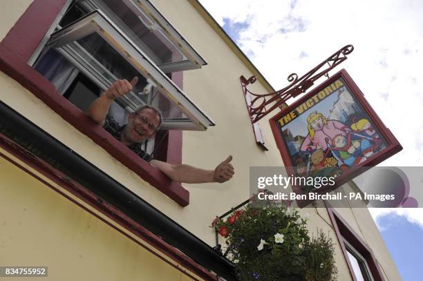 Pub owner Peter Gower-Crane stands inside his pub The Victoria in St Werburghs, Bristol, which has caused controversy by swapping a sign of Queen...