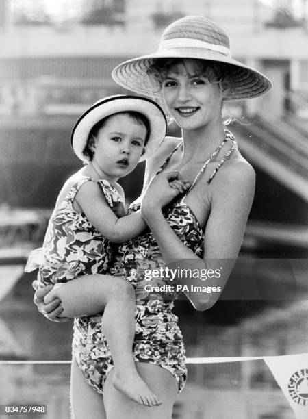 Chloe Black and child Kathryn Morris show off colourful swimsuits from Laura Ashley's Spring/Summer 1989 Mother and Child Collection. Chloe's ruched...