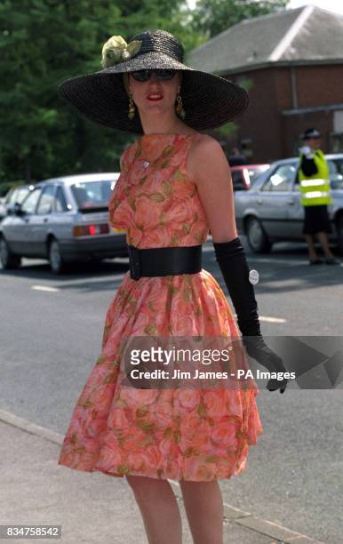 Stunning contrast of colour bloomed today at Ascot, as Victoria Grant stepped out wearing a peach floral dress and a black straw hat.