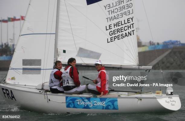 France's Anne le Halley, Catherine Lepesant and Julie Gerecht after the Women's Yngling Medal Race at the 2008 Beijing Olympic Games' Sailing Centre...