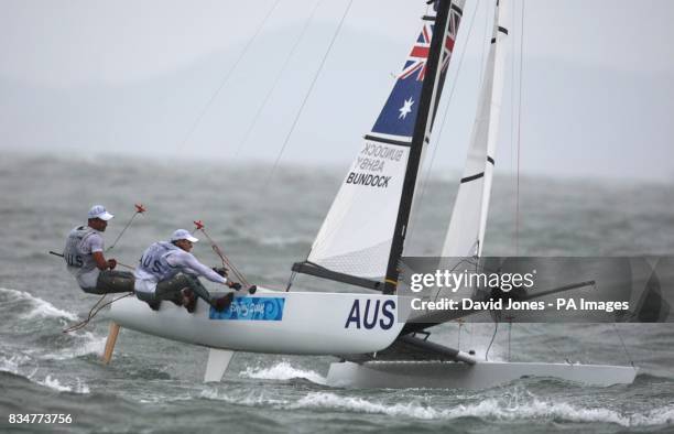 Australia's Darren Bundock and Glenn Ashby sail in the final race of the men's Tornado class at the Olympic Games' Sailing Centre in Qingdao on day...