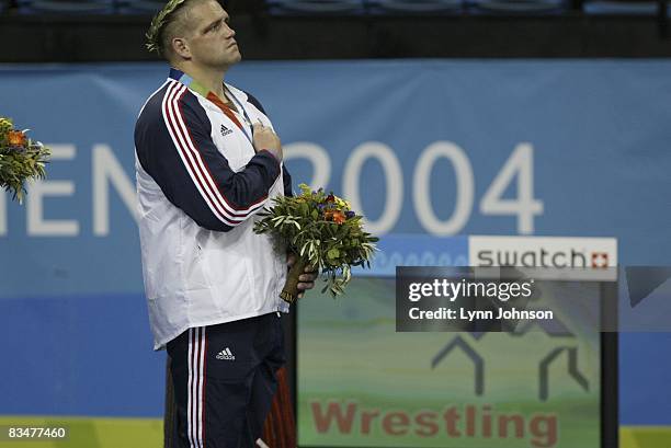 Greco-Roman Wrestling: 2004 Summer Olympics: USA Rulon Gardner victorious on medal stand after Men's 96kg-120kg bronze medal match at Ano Liossia...