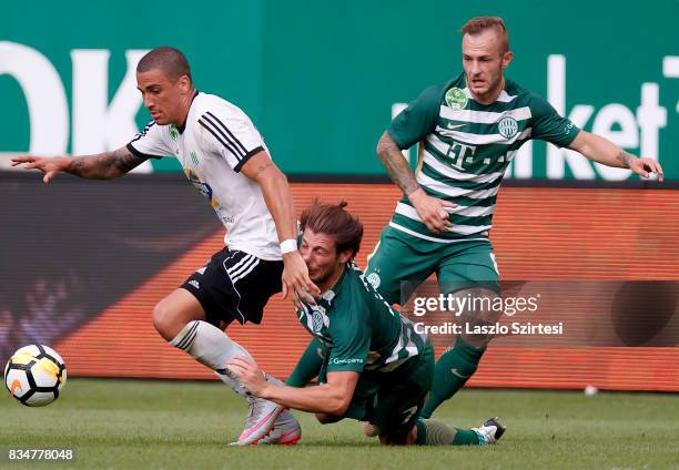 Myke Bouard Ramos of Swietelsky Haladas fights for the ball with Bence Batik of Ferencvarosi TC in front of Gergo Lovrencsics of Ferencvarosi TC...