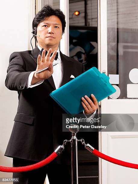doorman gesturing - bouncer stock pictures, royalty-free photos & images