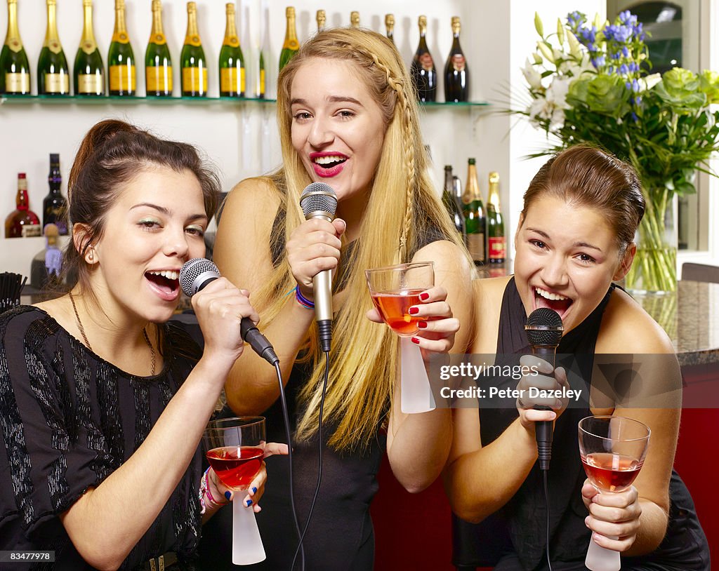 Teenage karaoke in bar