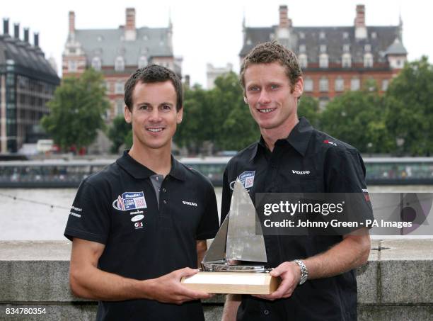 Olympic Sailing silver medallists Nick Rogers and Joe Glanfield show off trophies presented to them by team sponsor Skandia at a homecoming for Team...