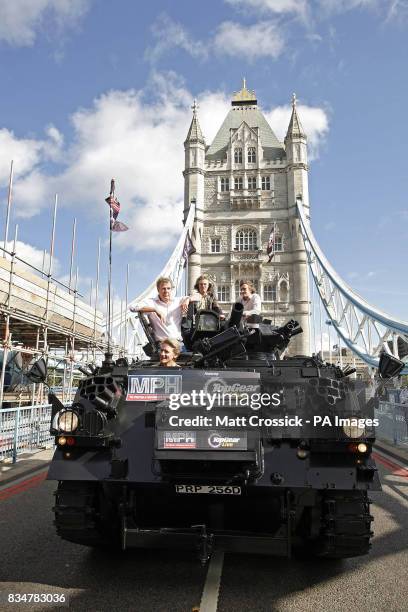 Top Gear presenters, Jeremy Clarkson, James May and Richard Hammond, are driven across Tower Bridge in a stretched 434 Armoured Personel Carrier, to...