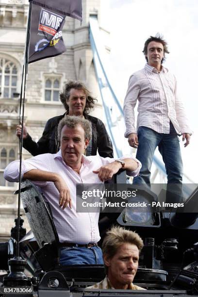 Top Gear presenters, Jeremy Clarkson, James May and Richard Hammond, are driven across Tower Bridge in a stretched 434 Armoured Personel Carrier, to...