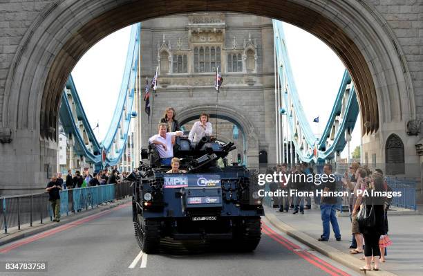 Top Gear presenters, Jeremy Clarkson, James May and Richard Hammond, are driven across Tower Bridge in a stretched 434 Armoured Personel Carrier, to...