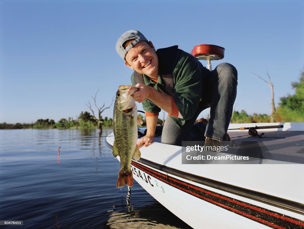 Man Getting Fish Portrait Of Man With Fish He Caught High-Res Stock Photo - Getty Images