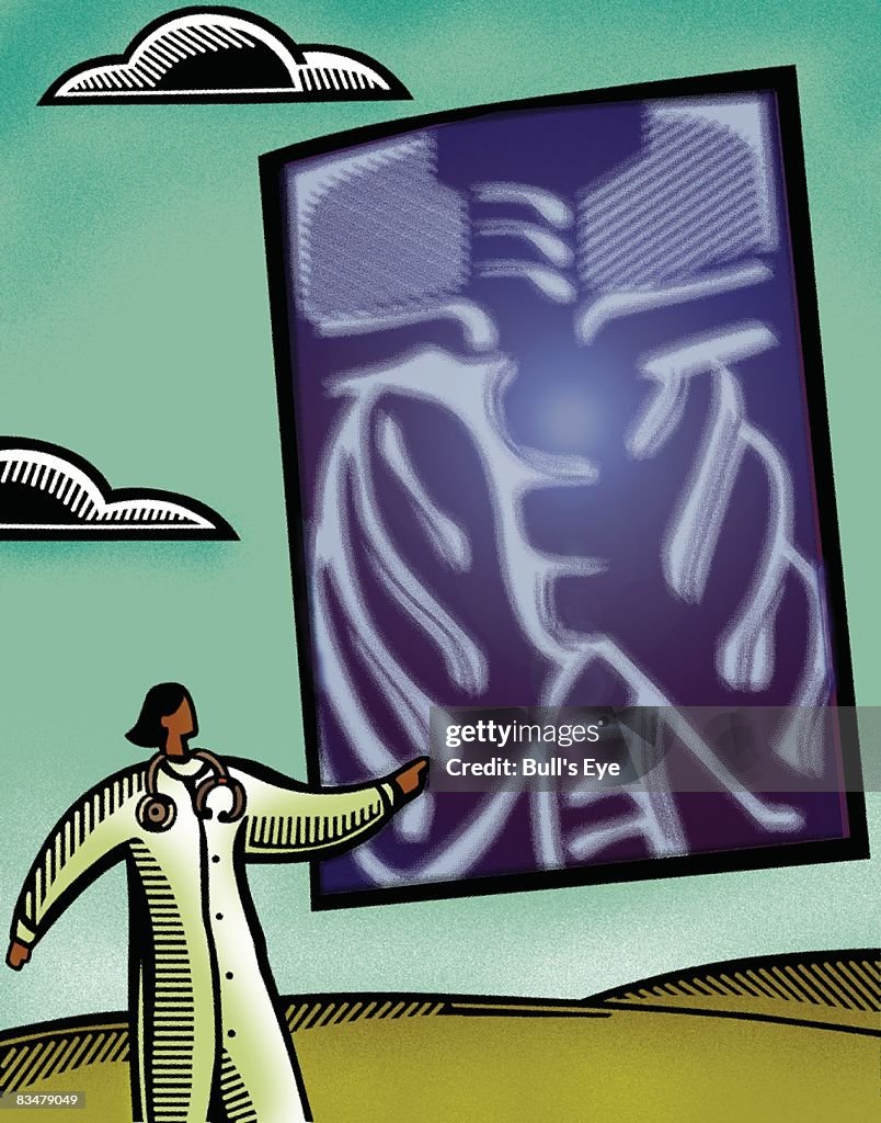 Doctor examining a large x-ray