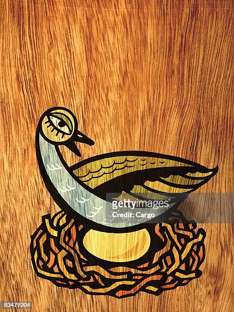 a bird sitting on a golden egg in a nest - incubate stock illustrations