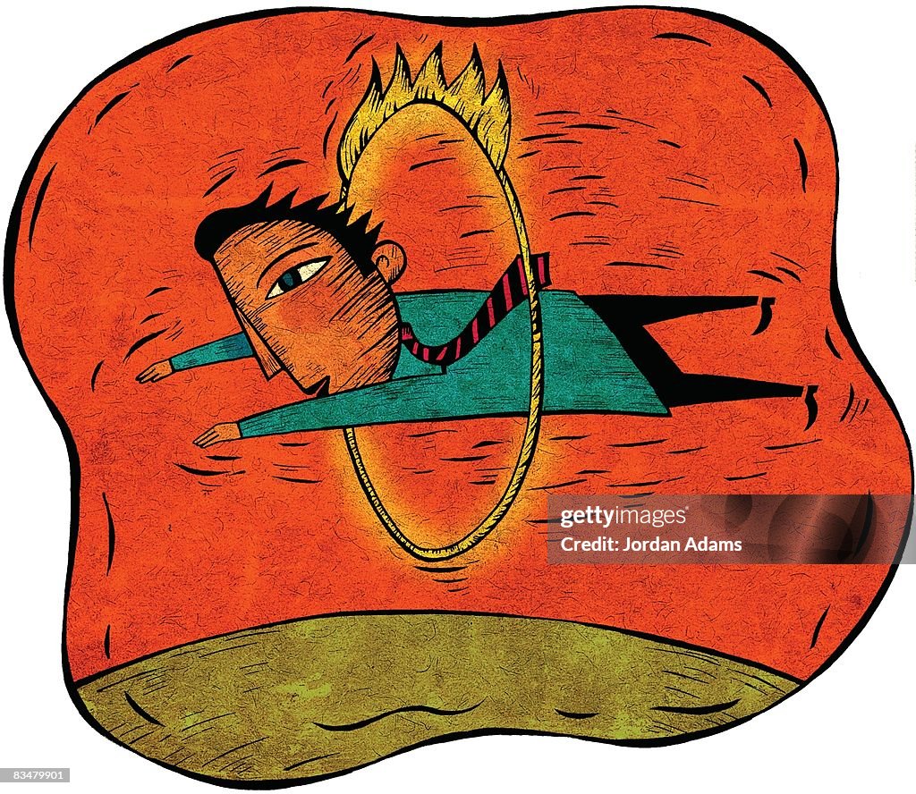 Businessman jumping through a ring of fire