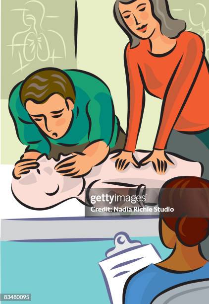 a man and woman demonstrating cpr on a dummy in front of a first aid instructor - befreiung atmen stock-grafiken, -clipart, -cartoons und -symbole
