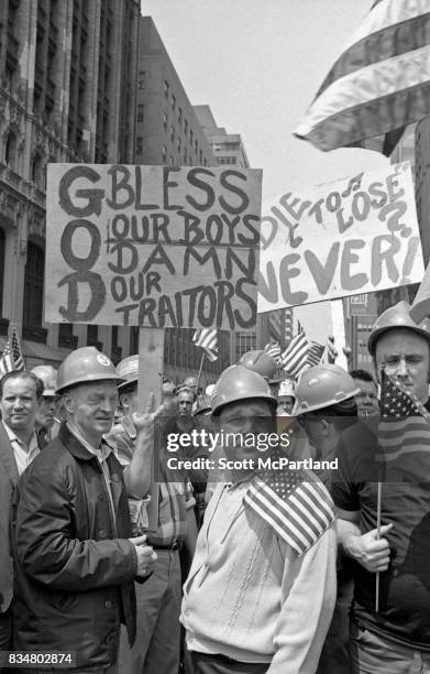 Downtown Manhattan May 1970: World Trade Center construction workers and war veterans alike protest Mayor Lindsey's decision to lower the American...