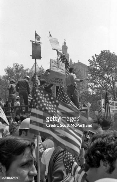 Downtown Manhattan May 1970: World Trade Center construction workers and war veterans alike protest Mayor Lindsey's decision to lower the American...