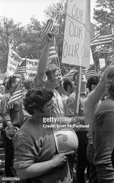 Downtown Manhattan May 1970: World Trade Center construction workers and war veterans alike angrily protest Mayor Lindsey's decision to lower the...