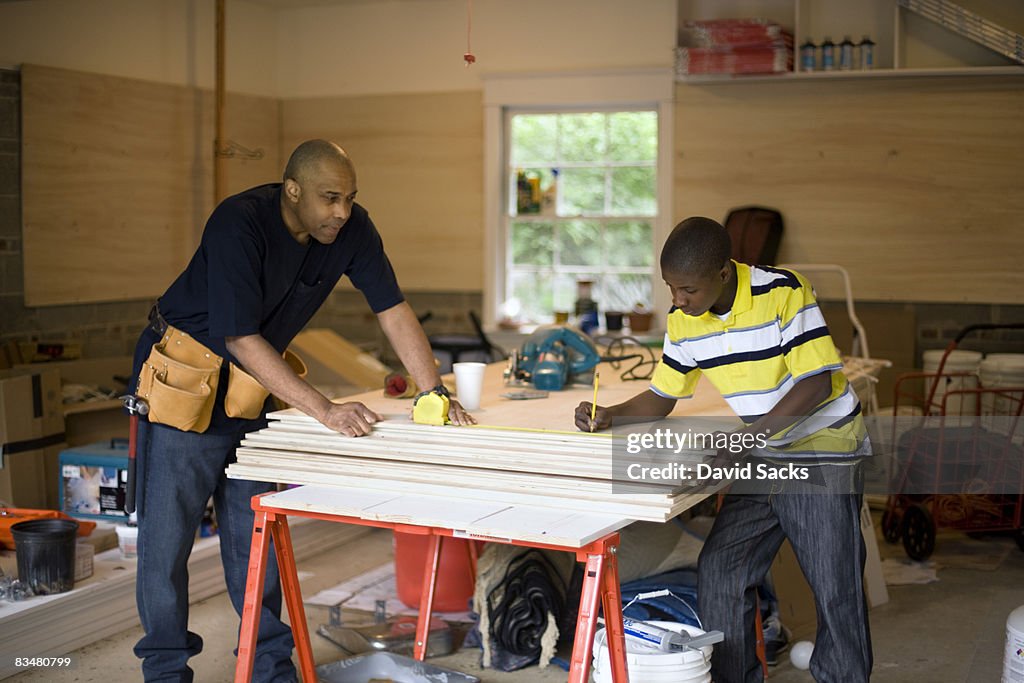 Father and son working in garage