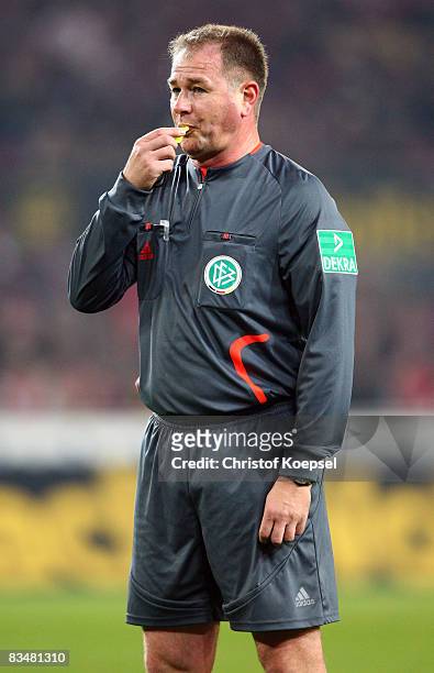 Referee Helmut Fleischer attends the 150th game during the Bundesliga match between 1. FC Koeln and Borussia Dortmund at the RheinEnergie stadium on...