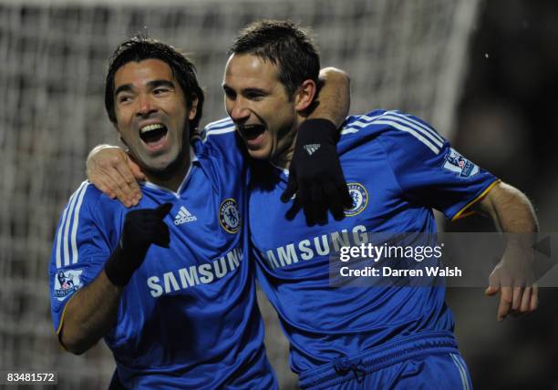 Frank Lampard of Chelsea celebrates scoring the opening goal with team mate Deco during the Barclays Premier League match between Hull City and...