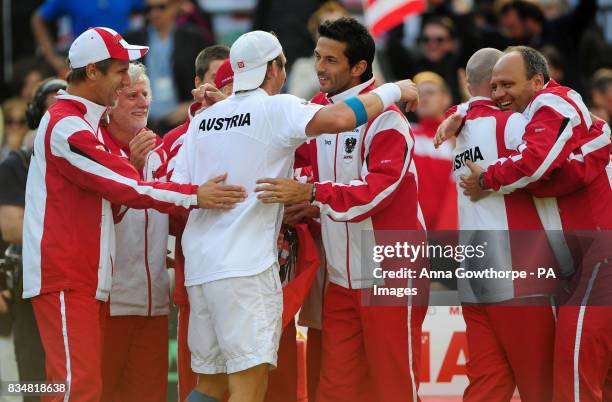 Austria's Alexander Peya is congratulated by team mate Julian Knowle as they celebrate their victory during the Davis Cup, World Group, Play-Offs at...