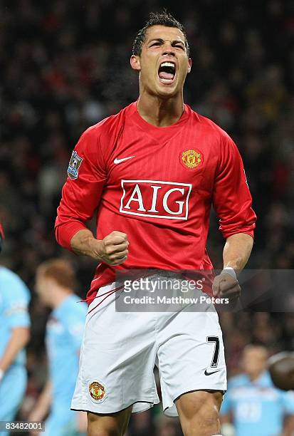 Cristiano Ronaldo of Manchester United celebrates scoring their first goal during the Barclays Premier League match between Manchester United and...
