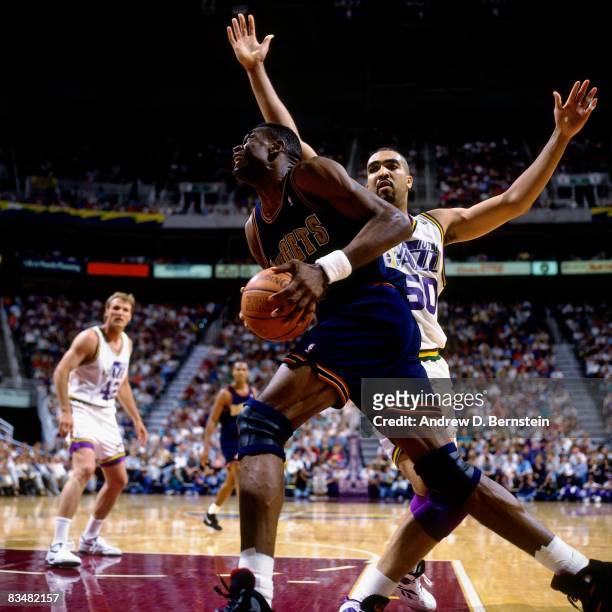 Dikembe Mutombo of the Denver Nuggets makes a move to the basket against Felton Spence of the Utah Jazz during Game One of the 1994 Western...