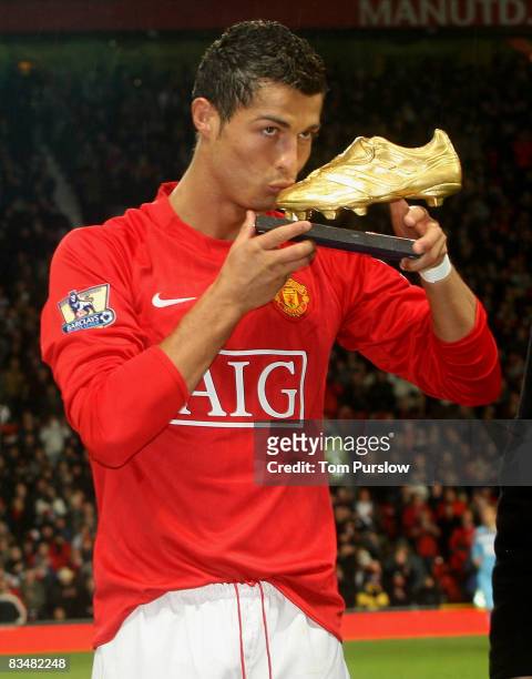 Cristiano Ronaldo of Manchester United poses with the European Golden Boot award as Europes top scorer for the 2007  2008 season ahead of the...