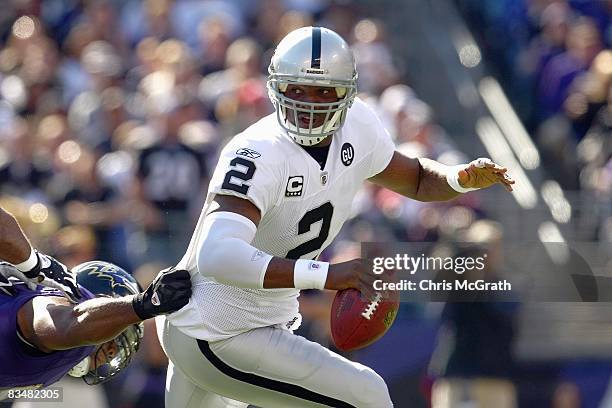 Quarterback JaMarcus Russell of the Oakland Raiders scrambles with the ball during the game against the Baltimore Raven at M&T Bank Stadium on...