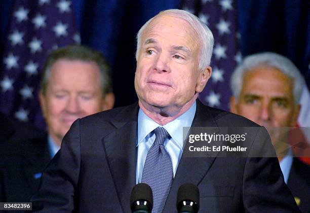 Republican presidential nominee Sen. John McCain with advisors including Florida Gov. Charlie Crist gives a speech to a crowd of supporters after a...