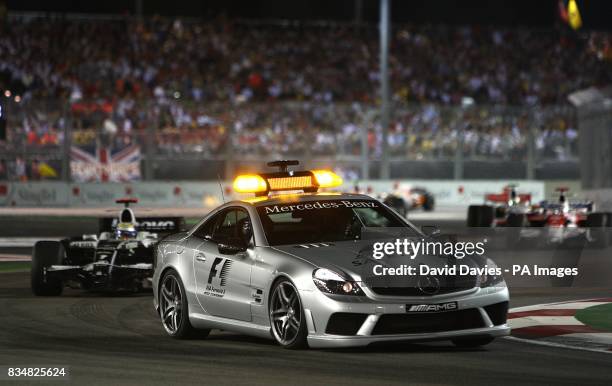The safety cars come out after Renault's Nelsinho Piquet crashes out during the Singapore Grand Prix