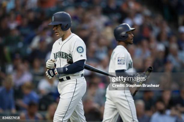 Danny Espinosa, left, of the Seattle Mariners walks past Jarrod Dyson of the Seattle Mariners after an at-bat during a game against the Baltimore...