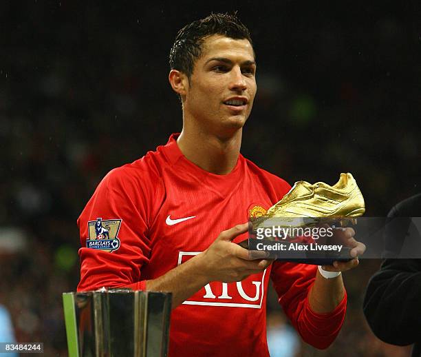 Cristiano Ronaldo of Manchester United poses with the European Golden Boot award as Europes top scorer for the 2007  2008 season before the...