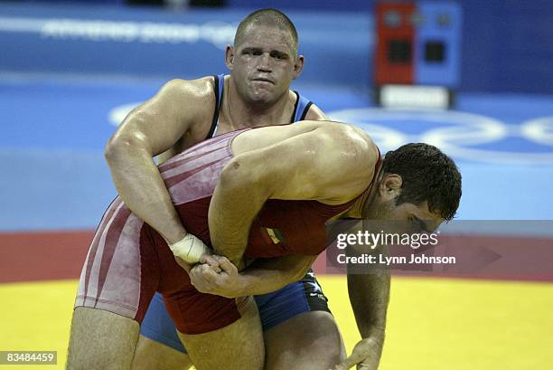 Greco-Roman Wrestling: 2004 Summer Olympics: USA Rulon Gardner in action vs Iran Sajjad Barzi during Men's 120kg Bronze Medal Match at Ano Liossia...