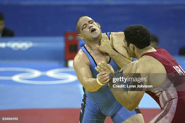 Greco-Roman Wrestling: 2004 Summer Olympics: USA Rulon Gardner in action vs Iran Sajjad Barzi during Men's 120kg Bronze Medal Match at Ano Liossia...