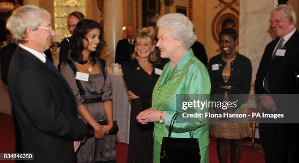 Queen Elizabeth II receives Blue Peter presenters, from left to right: John Noakes, Konnie Huq, Lesley Judd, Diane-Louise Jordan and Peter Purves,...