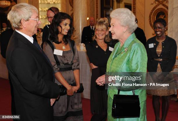 Queen Elizabeth II receives Blue Peter presenters, from left to right: John Noakes, Konnie Huq, Lesley Judd, and Diane-Louise Jordan, during a...