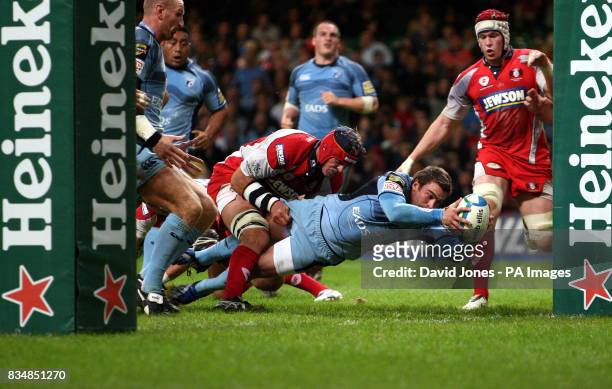 Cardiff Blues' Nick Robinson crosses for a try under the posts against Gloucester during the Heineken Cup match at the Millennium Stadium, Cardiff.