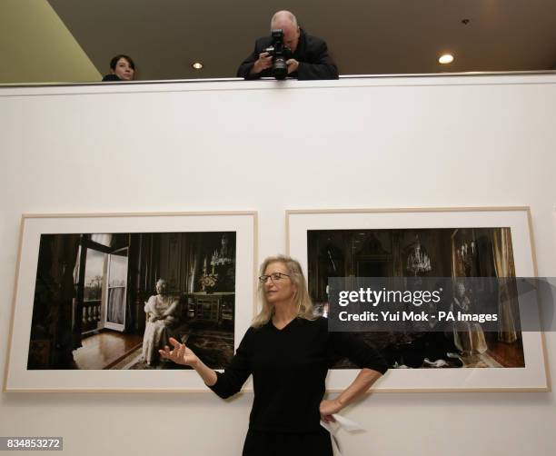 Photographer Annie Leibovitz, stands infront of two of her famous portraits of Queen Elizabeth II, during the press launch of her exhibition 'Annie...