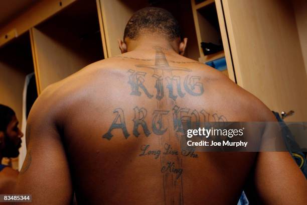 Darrell Arthur of the Memphis Grizzlies shows the tattoo on his back before a game against the Houston Rockets on October 29, 2008 at the Toyota...