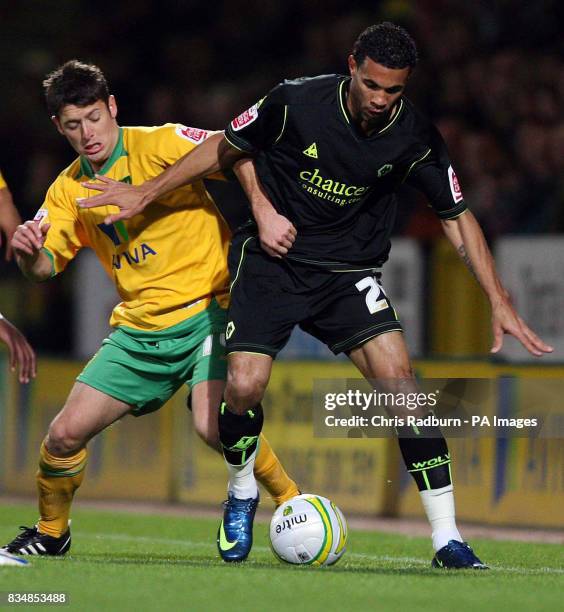 Norwich City's Maurice Sills tussles with Wolverhampton Wanderers' Carlos Edwards during the Coca-Cola Championship match at Carrow Road, Norwich.