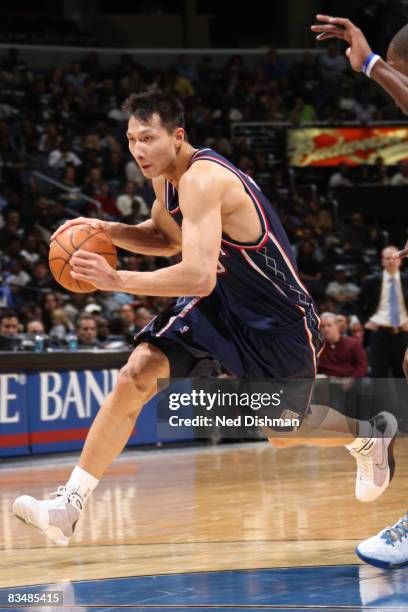 Yi Jianlian of the New Jersey Nets drives against the Washington Wizards at the Verizon Center on October 29, 2008 in Washington, DC. NOTE TO USER:...