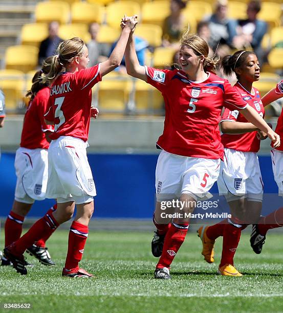 Naomi Chadwick and Jodie Jacobs of England celebrate team mate Dan Carter's goal during the Under 17 Womans World Cup match between the England and...