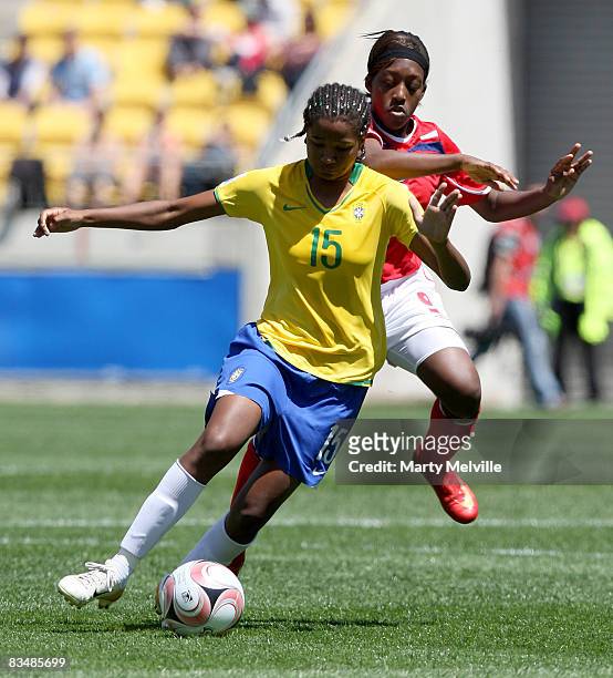 Juliana Cardozo of Brazil gets tackled by Dan Carter of England during the Under 17 Womans World Cup match between the England and Brazil at Westpac...