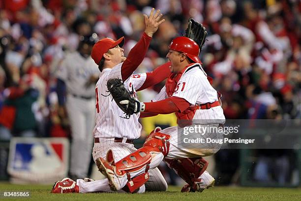 Brad Lidge and Carlos Ruiz of the Philadelphia Phillies celebrate the final out of their 4-3 win to win the World Series against the Tampa Bay Rays...