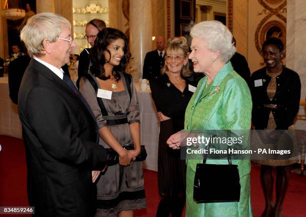 Queen Elizabeth II receives Blue Peter presenters, from left to right: John Noakes, Konnie Huq, Lesley Judd, and Diane-Louise Jordan, during a...