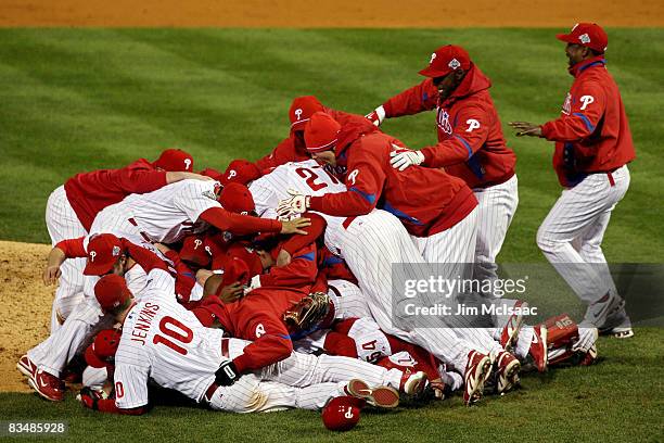 The Philadelphia Phillies pile on top of closing pitcher Brad Lidge after they won 4-3 to win the World Series against the Tampa Bay Rays during the...