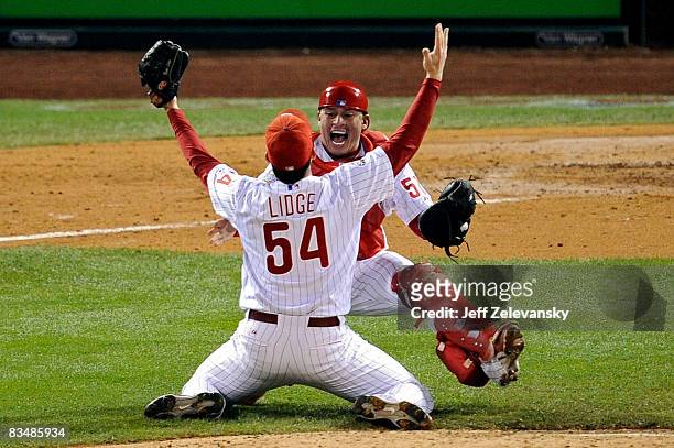 Catcher Carlos Ruiz and Brad Lidge of the Philadelphia Phillies celebrate after recording the final out of their 4-3 win to win the World Series...